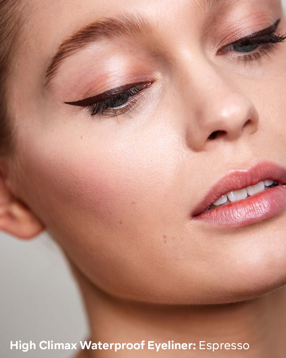 Close-up of a woman's eye with High Climax Waterproof Eyeliner in Espresso color.